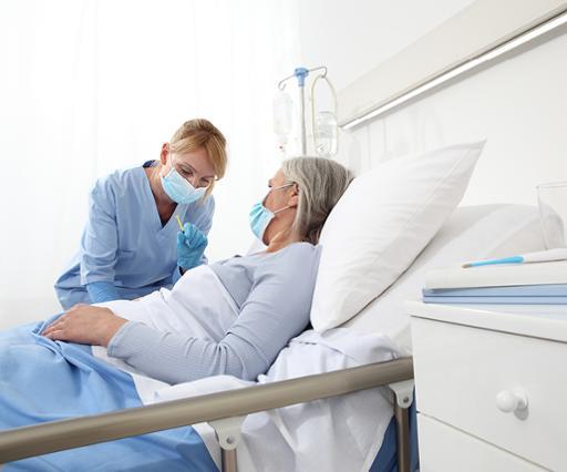 Health care worker assisting patient