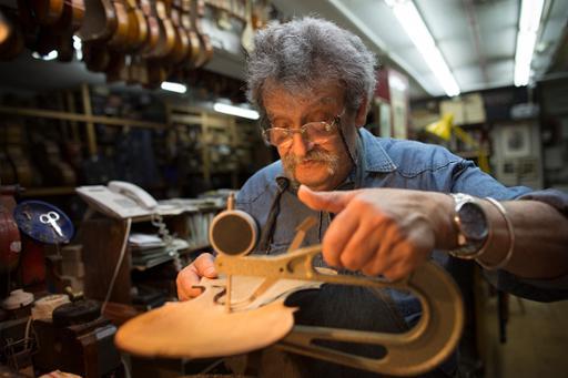 A Daniel Levin photograph of Amnon Weinstein in the luthier's workshop in Tel Aviv, Israel.
